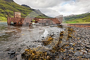 Mjoifjordur, Iceland - Abandoned fishing boat rusts in fjord