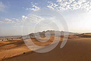 Mleiha Sand dune, deserts of Sharjah, with gold sand and blue sky photo