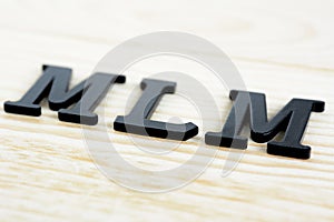 MLM sing on wood background