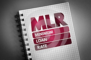 MLR - Minimum Loan Rate acronym on notepad, business concept background