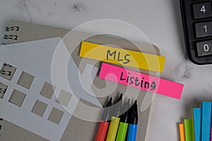 MLS Listing write on sticky notes isolated on office desk