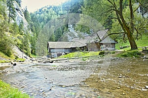 Mlyny - Oblazy building a wooden water mill in Kvacany Valley.