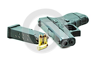 9mm bullets and black gun pistol isolated on white background.