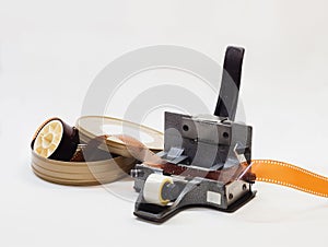 35mm film splicer with negative film roll on white background