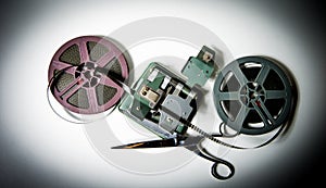 8mm movie reels, film on splicer ans scissors