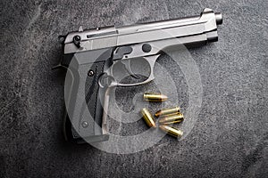 9mm pistol bullets and handgun. photo