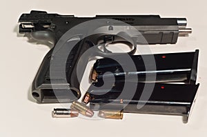 9MM, semi automatic hand gun, with sllide locked open and two-15 round magazines photo
