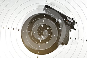 9 mm. semi automatic handgun and shooting target