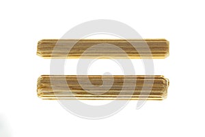 8 and 6 mm Wooden pegs on white background photo