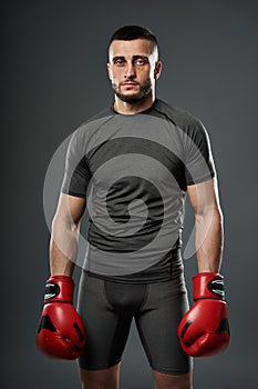MMA fighter posing on gray