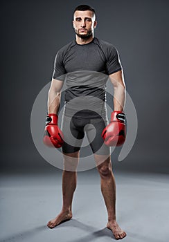 MMA fighter posing on gray
