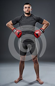 MMA fighter posing on gray