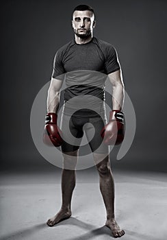 MMA fighter posing on gray