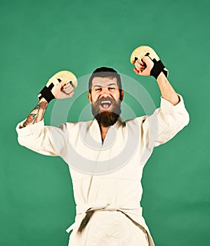 MMA fighter wins martial arts competition. Sports and combat concept. Man with excited winning face