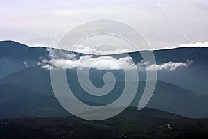 Mountains silhouettes with clouds. Lastra mountain ranges in Galicia, Spain. photo