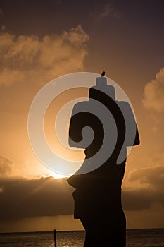 Moai shilouette during the sunset in Easter Island, Chile