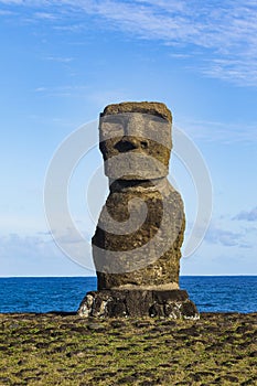 A Moai statue at the ocean photo