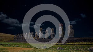 Moais on Ahu Tongariki moonlit under starry sky, Easter Island, Chile photo