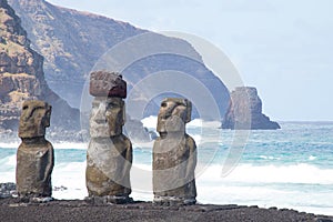 The  moais of Ahu Tongariki and the wild coast of Easter Island. Easter Island, Chile