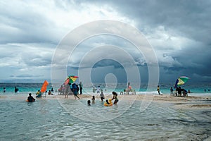 Moalboal. Cebu. Philippines - 06 aug 2016: Philippine families getting fun and rest while storm is coming to the