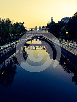 The moat at dusk reflects the beauty of the city