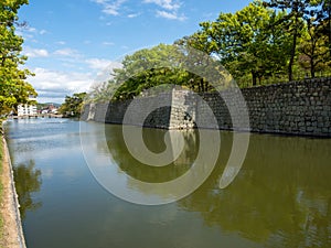 Moat of historic Marugame castle in springtime