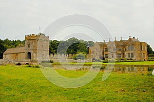 Moat and manor house in the Medieval castle photo