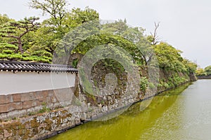 Moat and stone walls of Wakayama castle, Japan