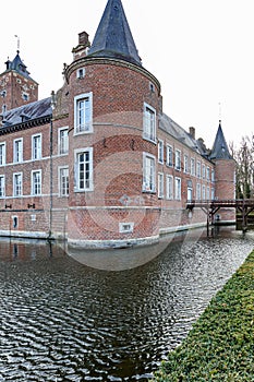 Moat surrounding circular tower of 16th century Alden Biesen Castle