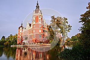 Moat and towers of New Castle in the park Muskauer