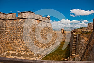 Moat and walls of the old fortress. Fort Castillo del Moro. Castle San Pedro de la Roca del Morro, Santiago de Cuba