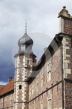 Moated castle Raesfeld Germany - Sun and clouds