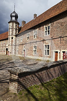 Moated castle Raesfeld Germany - Sun and clouds