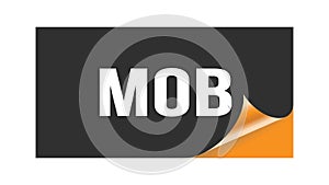 MOB text written on black orange sticker