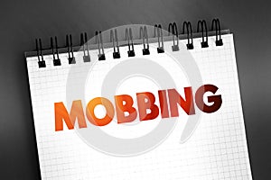 Mobbing - sociological term, means bullying of an individual by a group, text on notepad