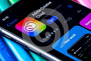 Mobile Adobe creative cloud app on appStore with a colorful plasticine background.