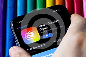 Mobile Adobe creative cloud app on appStore with a colorful plasticine background.