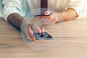 Mobile banking smartphone app used by businessman