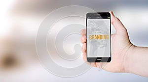 Mobile brandings on userÃÂ´s hand photo