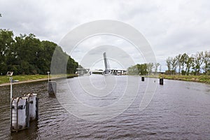 Mobile bridge rise up so that a cargo ship can pass