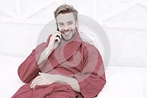 Mobile call. Communication mobile phone. Good news concept. Good morning. Hipster guy pajamas bathrobe freelance worker