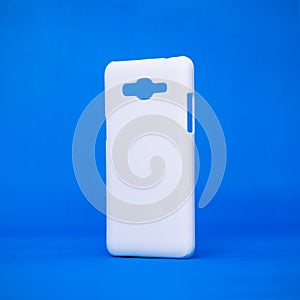 Mobile cases on vivid blue backdrops. Phone cover for your design. Smartphone accessory or trendy fashion