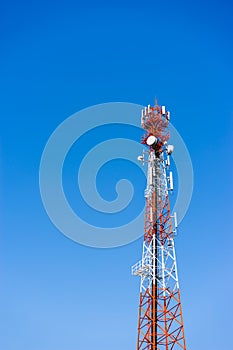 Mobile (cellular) tower antennas with blue sky background.