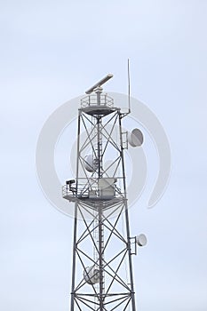 Mobile communication tower with many antennas.