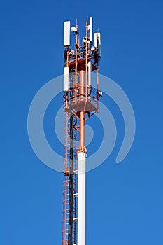 Mobile communications antenna that provides mobile telecommunications GSM 4G, 5G. Close-up against a clear blue sky