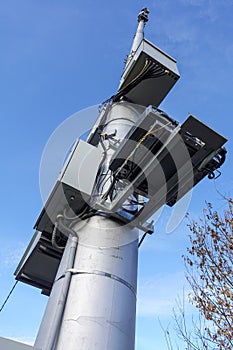 Mobile communications antenna tower against the blue sky