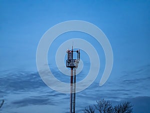 Mobile communications tower on the background of the night sky