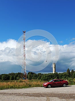 Mobile communications tower and old water tower in Povenets