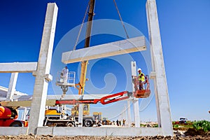 Mobile crane is carry concrete joist to assembly huge hall