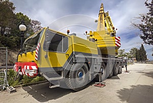 Mobile crane at construction site heavy truck big